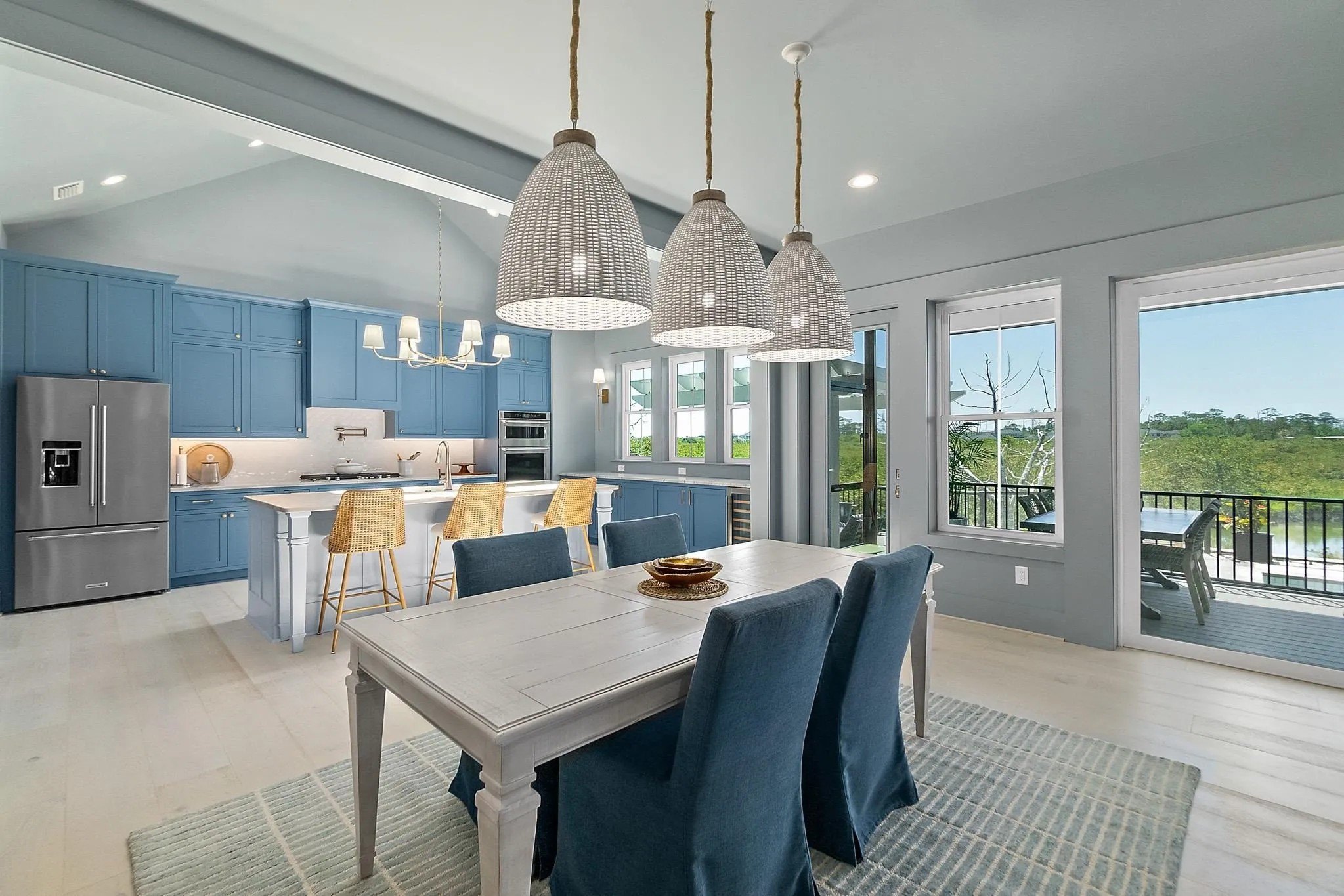 The dining room leads to the wide-open kitchen.