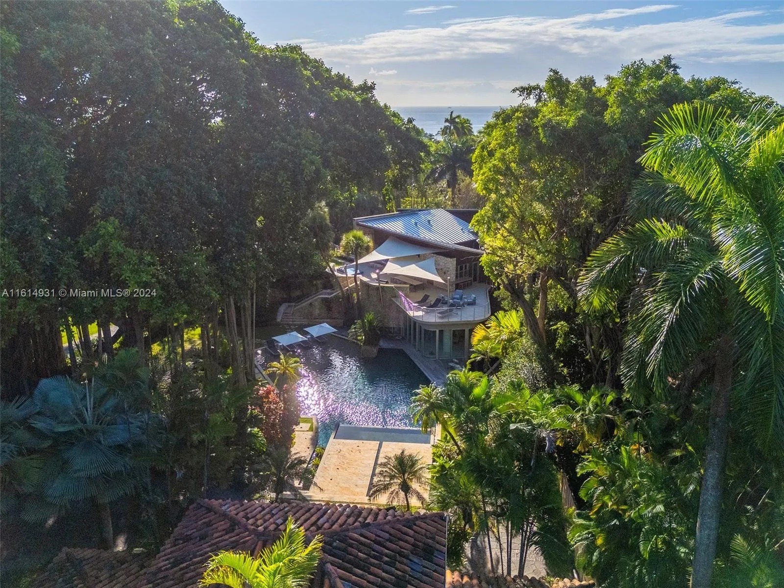 The Banyan Ridge Estate, for its irreplaceable 100-year-old Banyan tree, overlooks cascading waterfalls, tropical saltwater fishponds.