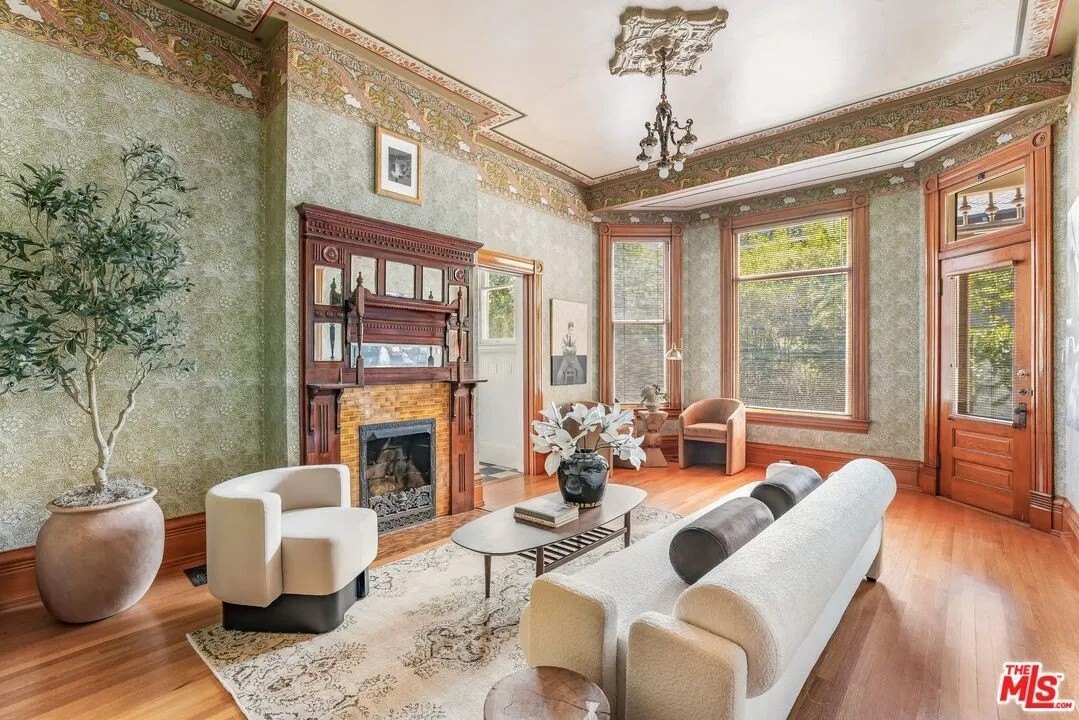 The fireplace, as well as much of the woodwork, has been lovingly brought up to date.