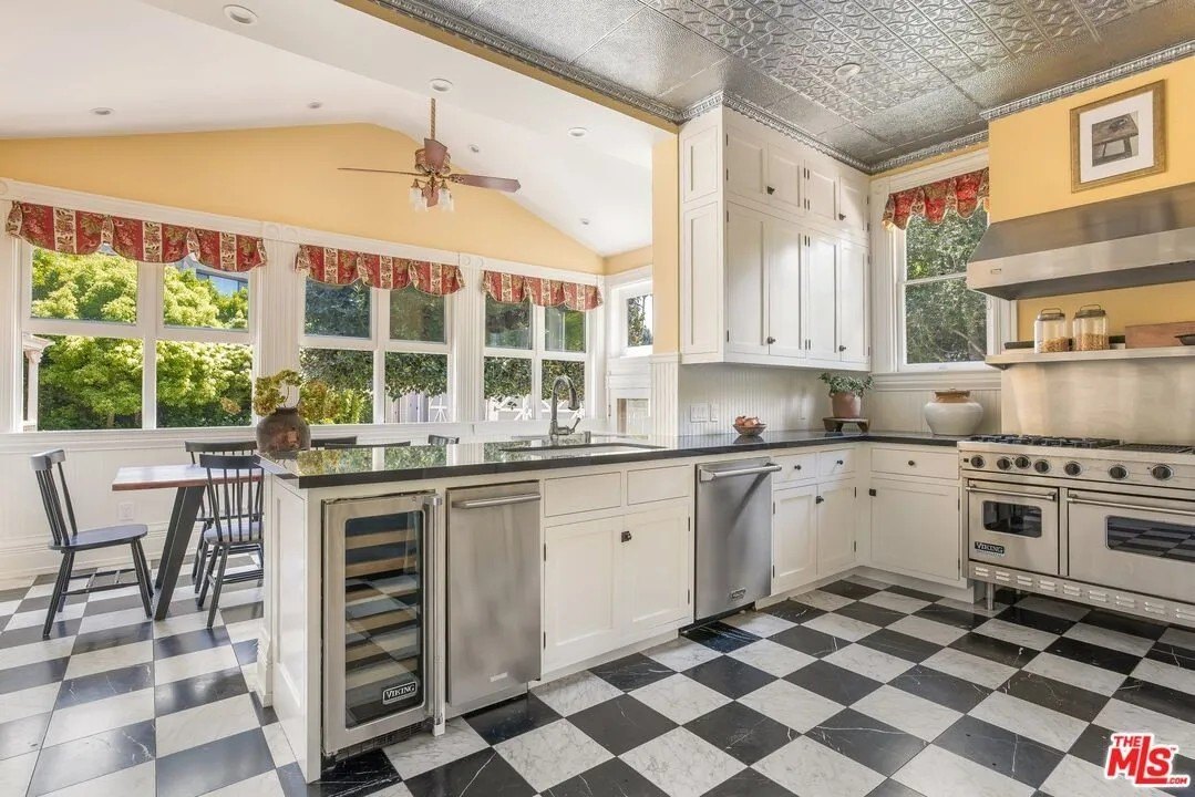 The sunny kitchen seamless blends modern and traditional.