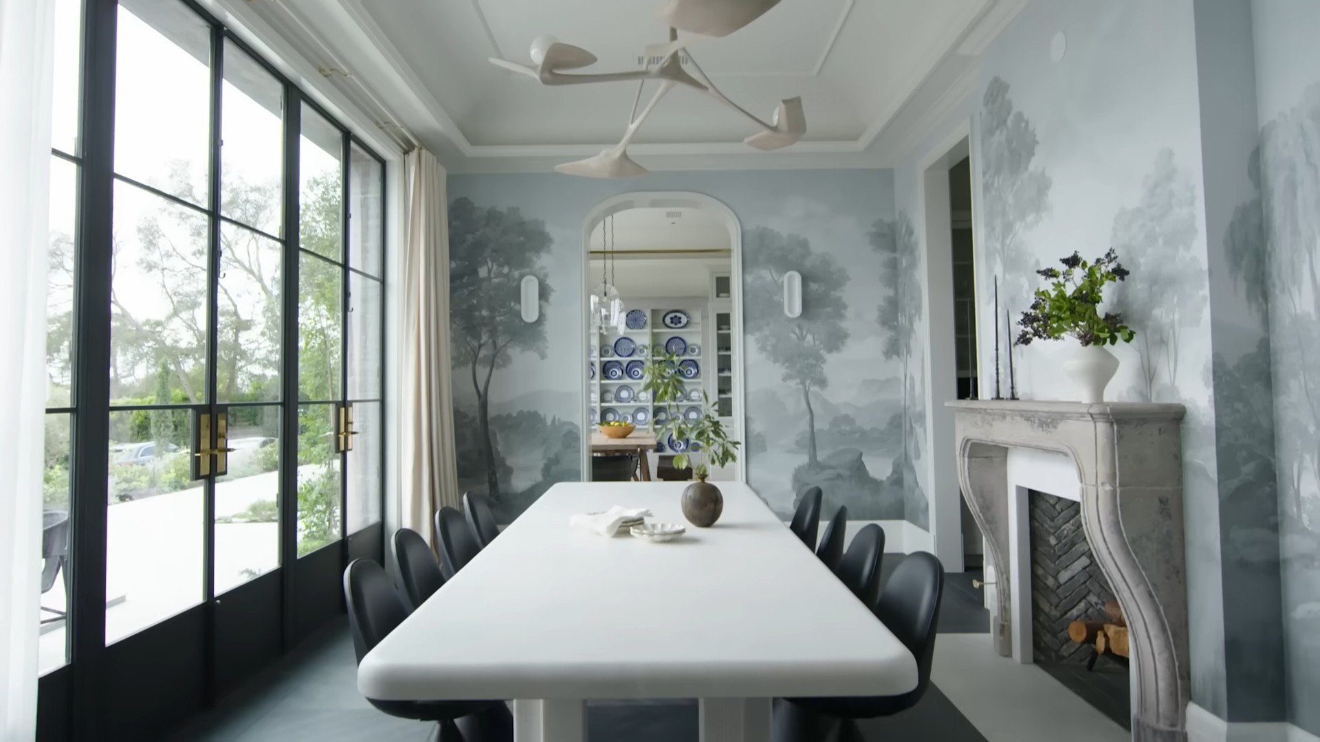 The unique dining room wallpaper elevates the room.