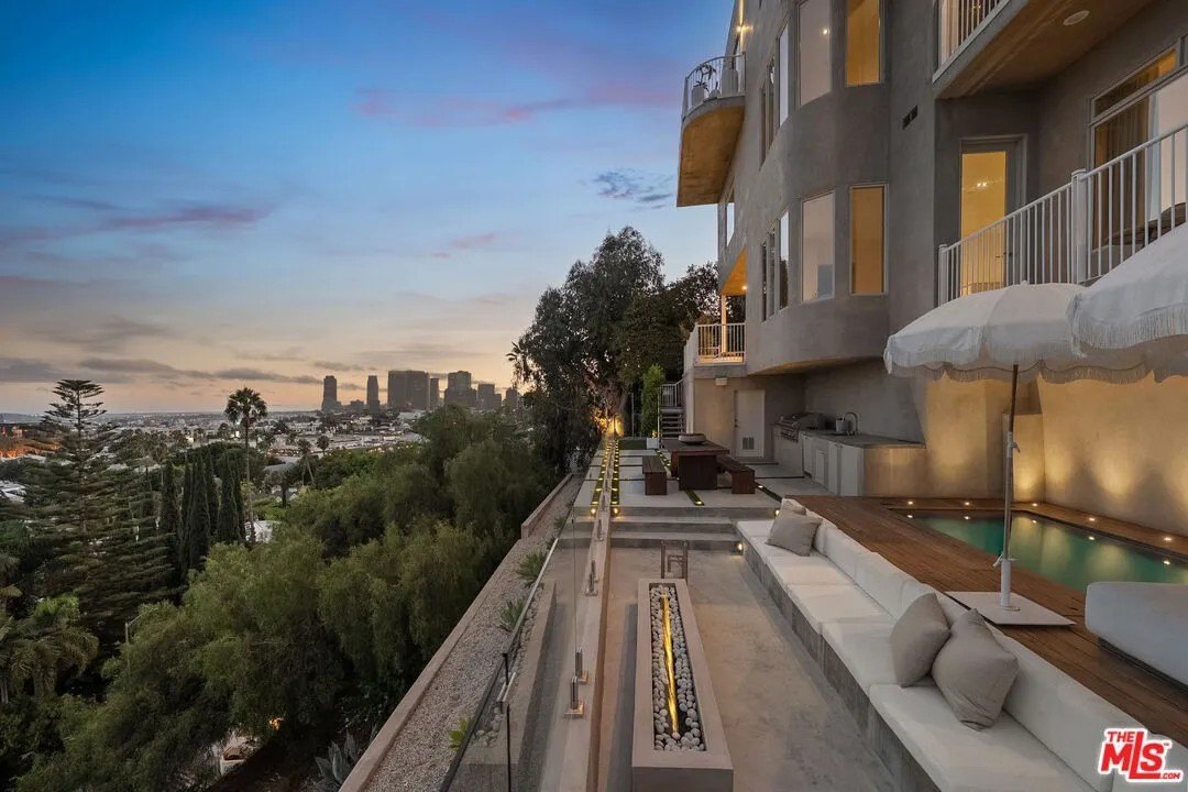 Chic new amenities including an in-ground spa, a sauna, an outdoor shower, and a dramatic fire pit on the terrace, surround by comfortable built-in seating, have been added. 