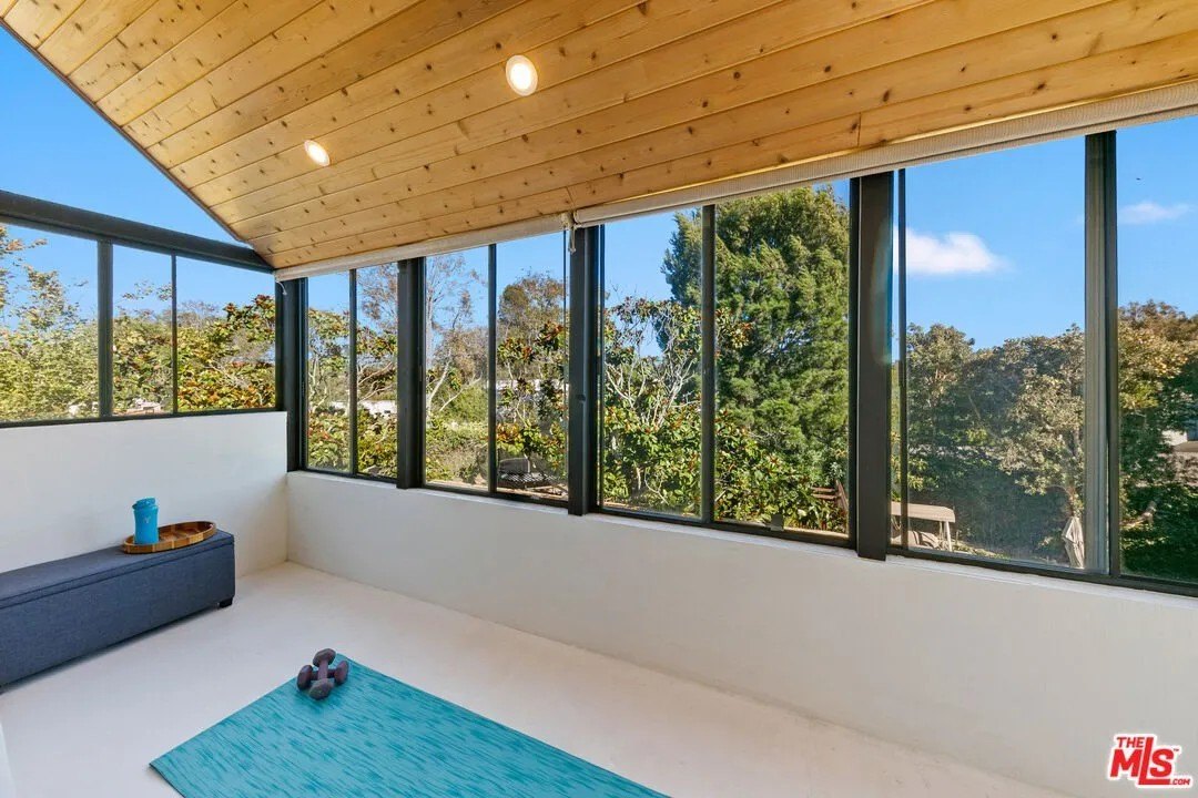 The main suite also includes a spacious enclosed balcony, ideal for yoga or meditation.