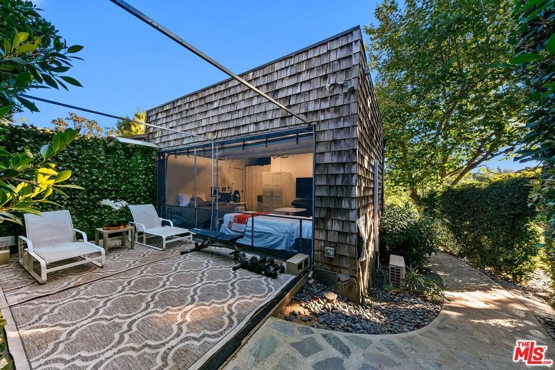 Guests can be accommodated in a garage conversion with its own private patio.