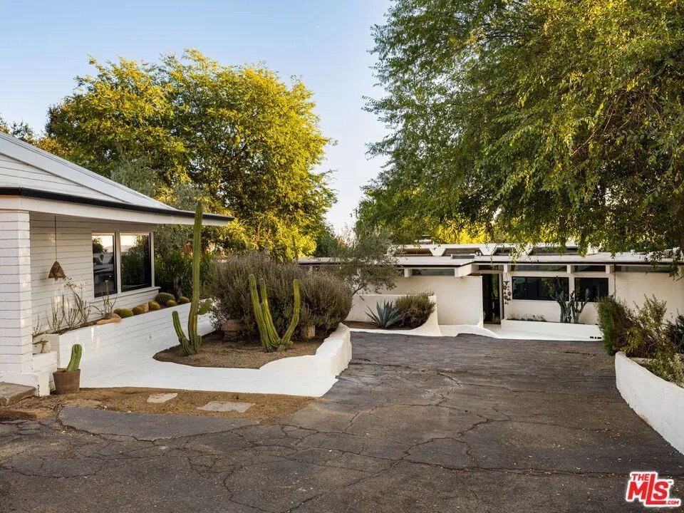 This classic mid-century modern compound built for artist David Green survived the devastating Eton Fire, and is currently on the market for  $2,449,000.