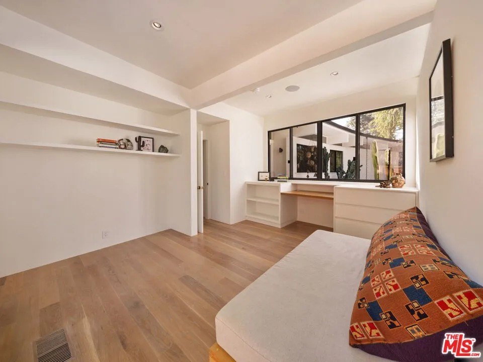 The main residence's bedrooms are highlighted by period built-ins shelves, desks and cabinets.
