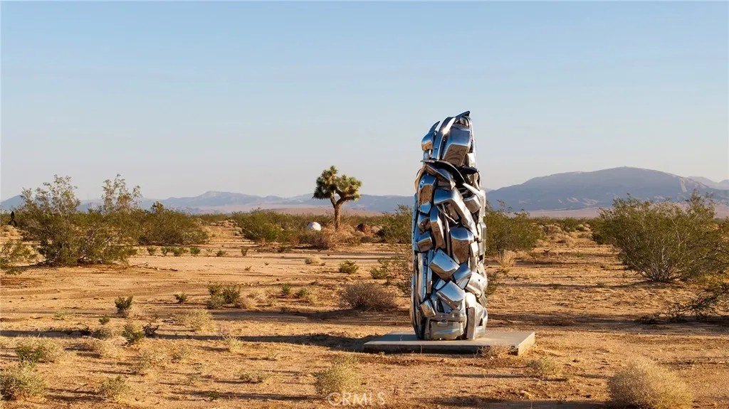 Unique sculptures ornament the barren desert grounds.