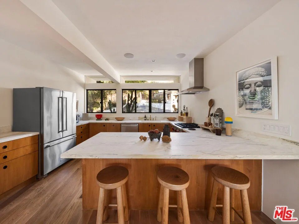 In 1964, Green hired USC architecture professor and Greene & Greene authority Randell Makinson, AIA to design the three-bedroom, two-bath main house. The kitchen has been updated but still complements the mid-century design of the rest of the home.