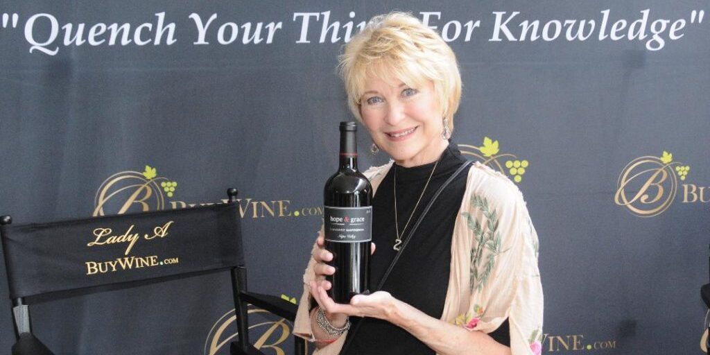 Dee Wallace, forever known as the mom in ET, with a bottle of Hope & Grace wine.